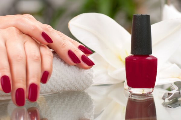 Manicure concept. Hand care at the spa. Beautiful woman's hands with perfect manicure at  beauty salon.